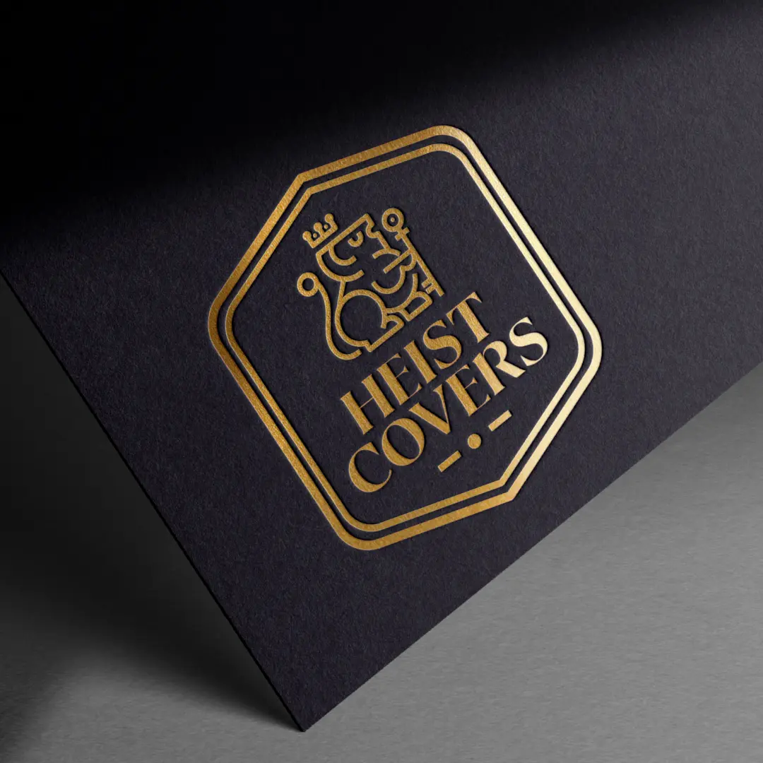 Heist Covers full logo badge in gold foil pressed on dark navy textured paper with octagonal frame and serif typography