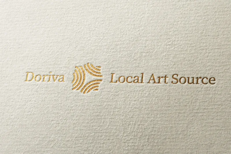 Doriva Local Art Source full logo with ripple mark icon in gold foil embossing on cream textured paper