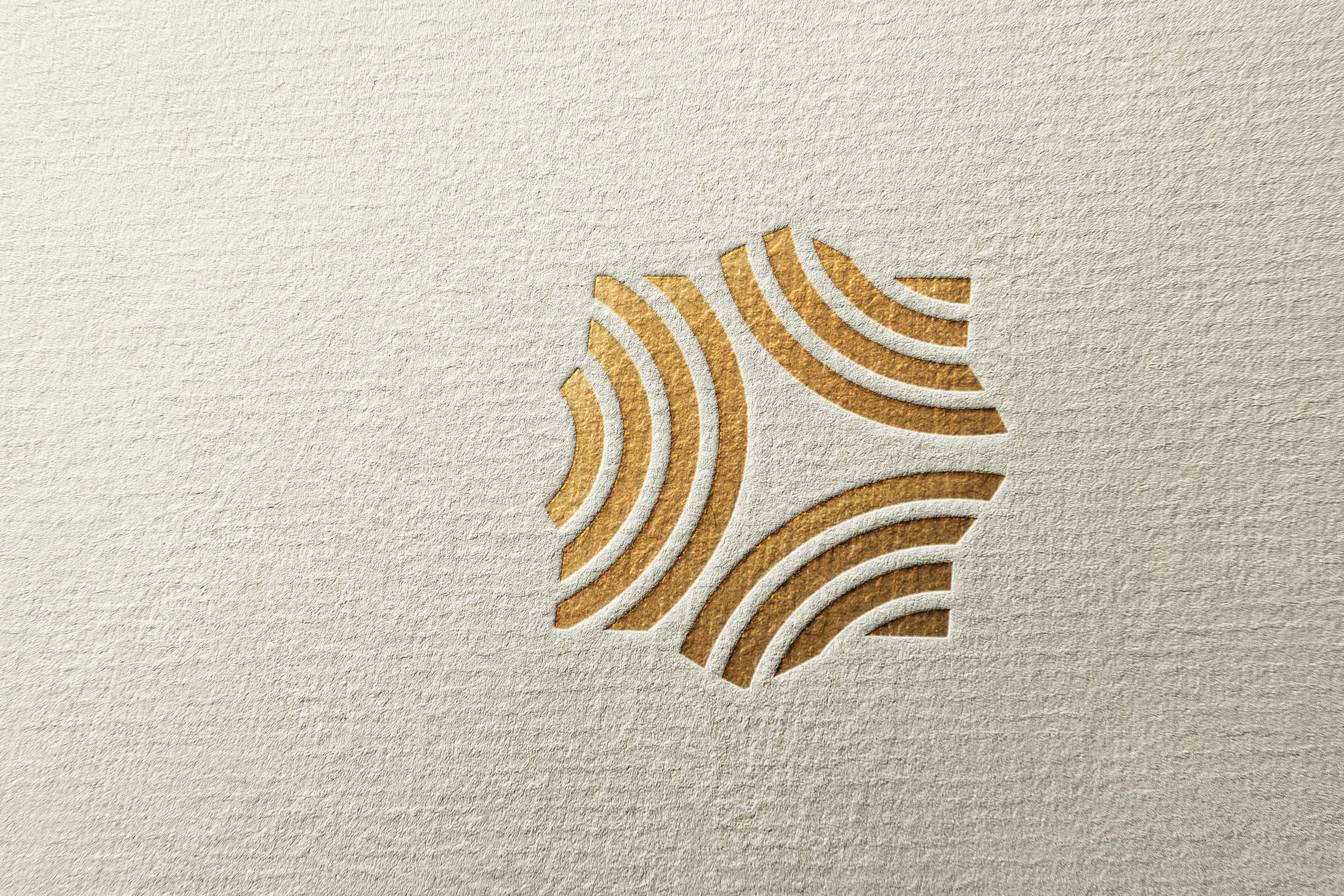 Doriva ripple mark icon in gold foil embossing on cream textured paper showing concentric wave lines radiating from center