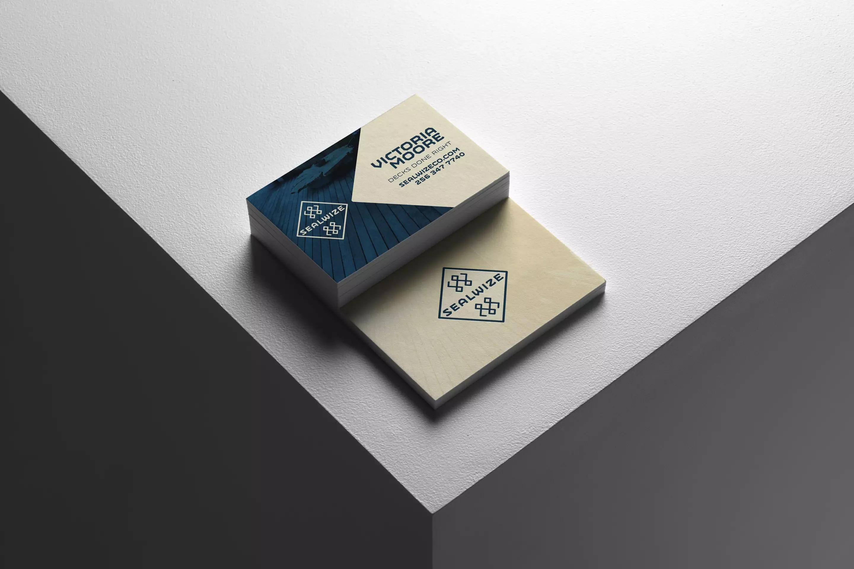 Stacked Sealwise business cards on a minimal background, showing both sides of the design